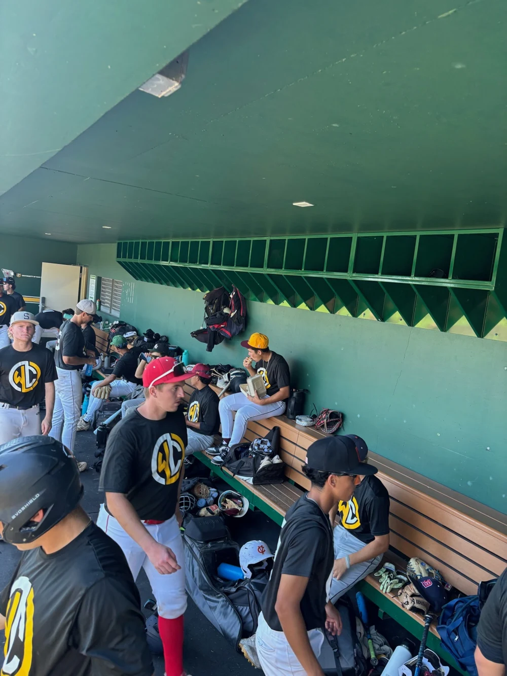 Diamond Access players together inside a college dugout